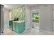 Stylish kitchen showcasing colorful cabinets, modern appliances, and an open doorway to the living area at 895 W Poplar St, Zionsville, IN 46077