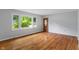 Bright and airy living room showcasing gleaming hardwood floors and abundant natural light at 895 W Poplar St, Zionsville, IN 46077
