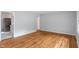 Spacious living room with hardwood floors, featuring an open doorway to the kitchen at 895 W Poplar St, Zionsville, IN 46077