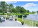Outdoor deck area overlooking a picturesque pond with fountain, perfect for relaxing at 896 Fairfield Dr, Greenfield, IN 46140