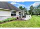 A cozy white deck is perfect for outdoor living, complemented by beautiful landscaping and greenery at 896 Fairfield Dr, Greenfield, IN 46140
