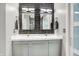 Modern bathroom featuring double sink vanity with gray cabinets and dark tile backsplash at 896 Fairfield Dr, Greenfield, IN 46140
