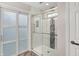 Contemporary bathroom featuring a glass-enclosed shower with white marble and gray tile at 896 Fairfield Dr, Greenfield, IN 46140