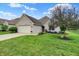 Charming, single-story brick home with a well-manicured lawn and an attached two-car garage at 896 Fairfield Dr, Greenfield, IN 46140