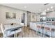 Bright kitchen featuring gray cabinets, granite countertops, and a breakfast bar with stylish seating at 896 Fairfield Dr, Greenfield, IN 46140