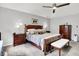 Cozy main bedroom suite with a ceiling fan, carpet, and traditional furnishings at 896 Fairfield Dr, Greenfield, IN 46140