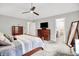 Comfortable bedroom suite with a ceiling fan, carpet, and traditional furnishings at 896 Fairfield Dr, Greenfield, IN 46140