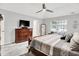 Comfortable bedroom suite with a ceiling fan, carpet, and traditional furnishings at 896 Fairfield Dr, Greenfield, IN 46140