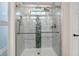 Beautiful walk-in shower featuring neutral marble tile and modern fixtures at 896 Fairfield Dr, Greenfield, IN 46140