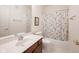 Traditional bathroom includes a vanity with wood accents and a shower-tub combo at 9117 Thoreau Ct, Fishers, IN 46037