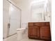 Functional bathroom featuring a shower with glass door and a dark wood vanity at 9117 Thoreau Ct, Fishers, IN 46037