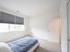 Bright bedroom features a large window, plush carpet, and a serene, minimalist design at 9117 Thoreau Ct, Fishers, IN 46037