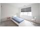 Minimalist bedroom with natural light, neutral decor, and modern furniture at 9117 Thoreau Ct, Fishers, IN 46037
