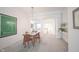 Dining room with glass top table and view of additional living space through arched doorways at 9117 Thoreau Ct, Fishers, IN 46037