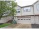 Pleasant townhome with attached garage, brick and neutral siding, and mature landscaping at 9117 Thoreau Ct, Fishers, IN 46037