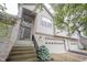Charming townhome exterior with brick accents, attached garage, and landscaped front yard at 9117 Thoreau Ct, Fishers, IN 46037