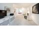 Open-concept living area with neutral carpet, modern lighting, and ample natural light at 9117 Thoreau Ct, Fishers, IN 46037