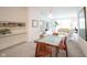 Spacious living and dining area with neutral carpet, white walls, and abundant natural light at 9117 Thoreau Ct, Fishers, IN 46037