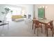 Bright living room with modern furnishings, a cozy fireplace, and a large tree at 9117 Thoreau Ct, Fishers, IN 46037