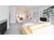 Bright living room with fireplace that opens to the dining room through arched entryway at 9117 Thoreau Ct, Fishers, IN 46037