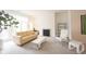Bright living room with modern furnishings, a fireplace and large windows at 9117 Thoreau Ct, Fishers, IN 46037
