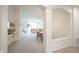 Open-concept living space with neutral carpet, columned arches, and natural light at 9117 Thoreau Ct, Fishers, IN 46037