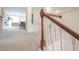 Spacious living room with neutral carpet, staircase, and bright natural light at 9117 Thoreau Ct, Fishers, IN 46037