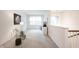 Light-filled upstairs area with neutral carpet, white walls, and natural light at 9117 Thoreau Ct, Fishers, IN 46037