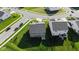 Aerial view of a well-maintained property with a spacious backyard, two-story home, and neighborhood streets at 9717 Chuckwalla Pl, Fishers, IN 46040