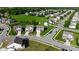 Aerial view of suburban homes with manicured lawns and tree-lined streets highlighting the neighborhood's appeal and close proximity to green space at 9717 Chuckwalla Pl, Fishers, IN 46040