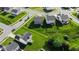 An aerial view of homes with lush green lawns and well-maintained landscaping, showcasing a Gathering-friendly neighborhood at 9717 Chuckwalla Pl, Fishers, IN 46040
