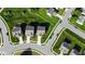 Overhead shot of homes with driveways and manicured lawns in a suburban neighborhood, capturing the layout of houses and streets at 9717 Chuckwalla Pl, Fishers, IN 46040