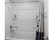 Clean bathroom featuring a shower-tub combo with a curved shower rod and shelving for toiletries at 9717 Chuckwalla Pl, Fishers, IN 46040