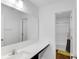Well-lit bathroom featuring a modern vanity with sleek countertops and a view of the shower-tub combo at 9717 Chuckwalla Pl, Fishers, IN 46040