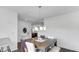 The dining room features a modern table, chandelier, and hardwood floors at 9717 Chuckwalla Pl, Fishers, IN 46040