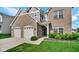Lovely brick home featuring a well maintained lawn, two-car garage and inviting front entrance at 9717 Chuckwalla Pl, Fishers, IN 46040