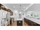 Modern kitchen with stainless steel appliances, white countertops, and an open view to the dining area at 9717 Chuckwalla Pl, Fishers, IN 46040