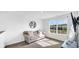 Cozy living room with a comfortable sofa, modern decor, and natural light streaming through a large window at 9717 Chuckwalla Pl, Fishers, IN 46040