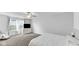 Clean main bedroom with plush carpet, white bedding, natural light, and a ceiling fan for comfort at 9717 Chuckwalla Pl, Fishers, IN 46040