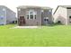 Large backyard, features a deck, a patio and well manicured lawn at 9903 Deep Royal Way, Indianapolis, IN 46239