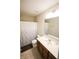 Bathroom features a wood vanity, a toilet and a shower with curtain at 9903 Deep Royal Way, Indianapolis, IN 46239