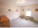 Bright bedroom featuring neutral walls, a window, and gray carpeting at 9903 Deep Royal Way, Indianapolis, IN 46239