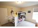 Neutral bedroom featuring a bunk bed, a gray carpet, and a window at 9903 Deep Royal Way, Indianapolis, IN 46239