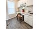 Home office nook features white cabinets, a desk, chair, and a window for natural light at 9903 Deep Royal Way, Indianapolis, IN 46239