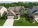 Charming two-story home with well-maintained lawn and attached two-car garage at 9903 Deep Royal Way, Indianapolis, IN 46239