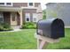 Close-up of a mailbox in front of a home, with a well-kept lawn and a view of the house at 9903 Deep Royal Way, Indianapolis, IN 46239