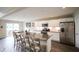 Modern kitchen with a large island, stainless steel appliances, and ample cabinet space, perfect for cooking at 9903 Deep Royal Way, Indianapolis, IN 46239