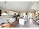 Bright, open kitchen featuring an island with seating, stainless steel appliances, and seamless flow to the dining area at 9903 Deep Royal Way, Indianapolis, IN 46239
