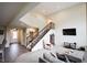 Open living space highlighting the staircase and transition to other areas, offering a modern and airy feel at 9903 Deep Royal Way, Indianapolis, IN 46239