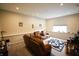 Spacious carpeted living room with recessed lighting and comfortable leather recliners at 9903 Deep Royal Way, Indianapolis, IN 46239